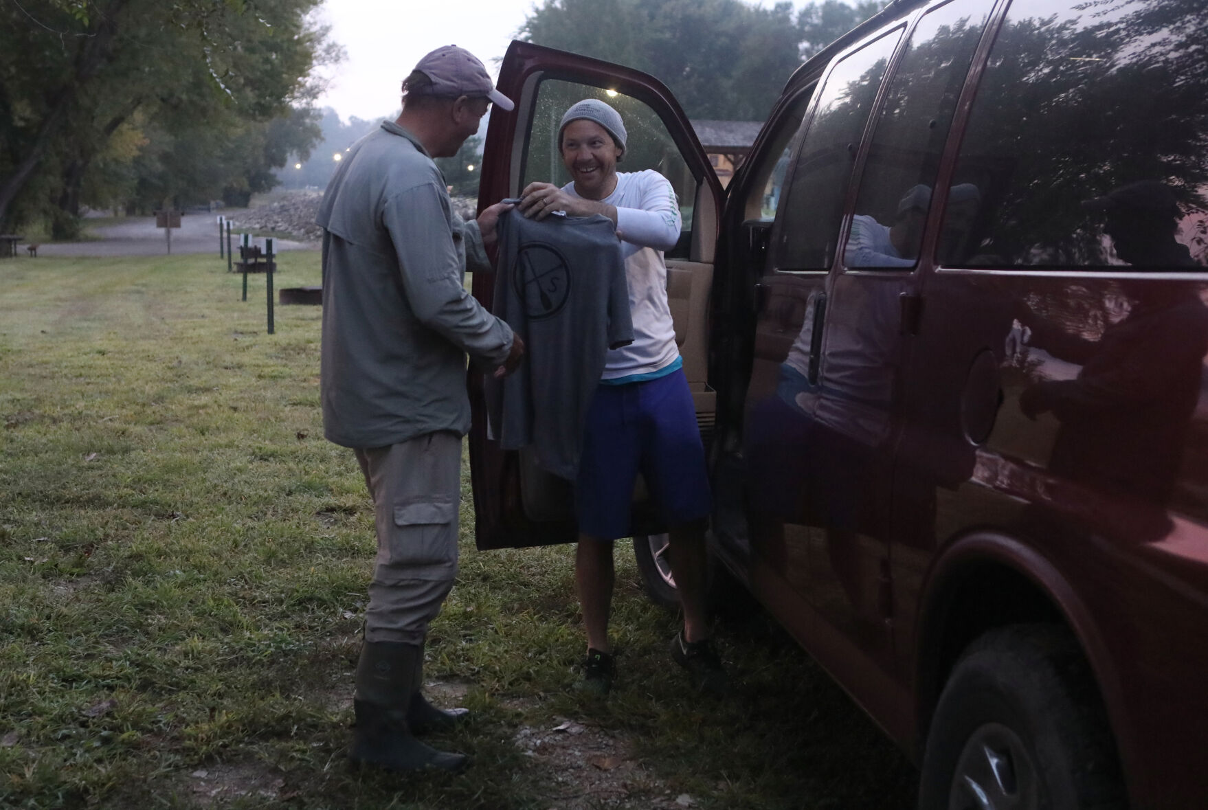 Shane Camden gifts Neal Moore a t-shirt